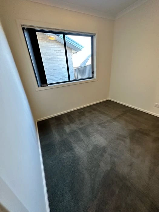 Professional house cleaner working in a Sydney home