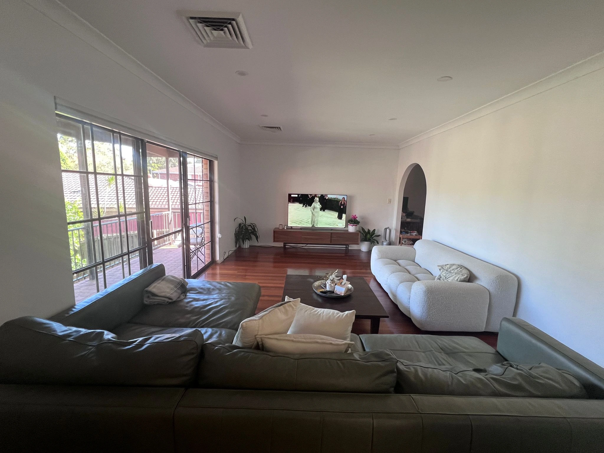 Professional house cleaner at work in a Sydney home